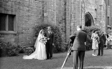 A newlywed couple standing in