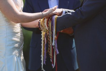 bride and groom during handfasting service