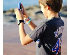 child using an iphone to take images during a marriage ceremony