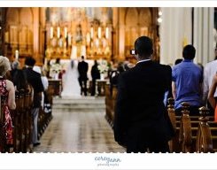 guest standing in aisle to just take a picture during wedding service in cleveland