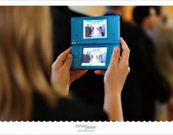 guest utilizing nintendo ds to just take pictures during wedding ceremony