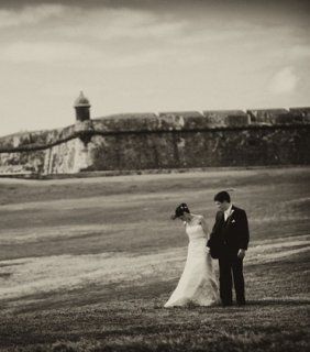 picture of bride and groom kissing inside sea.